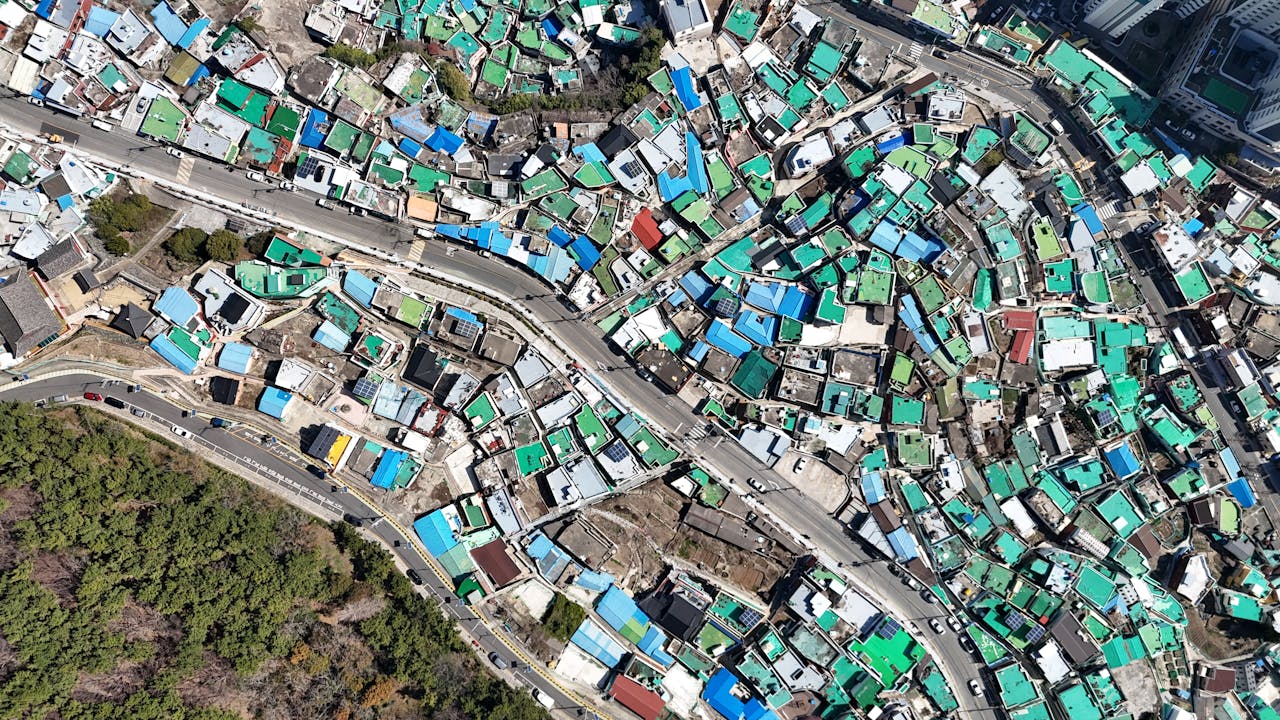 A stunning aerial view of Gamcheon Culture Village in Busan, South Korea, showcasing colorful rooftops.